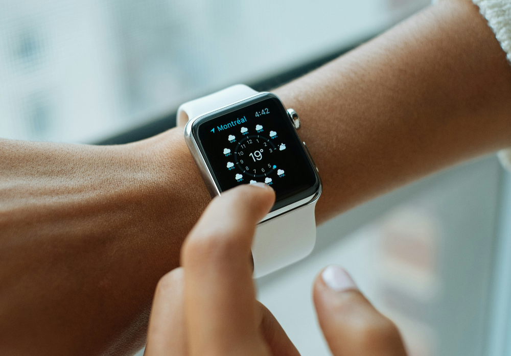 An employee wears an apple watch on their wrist