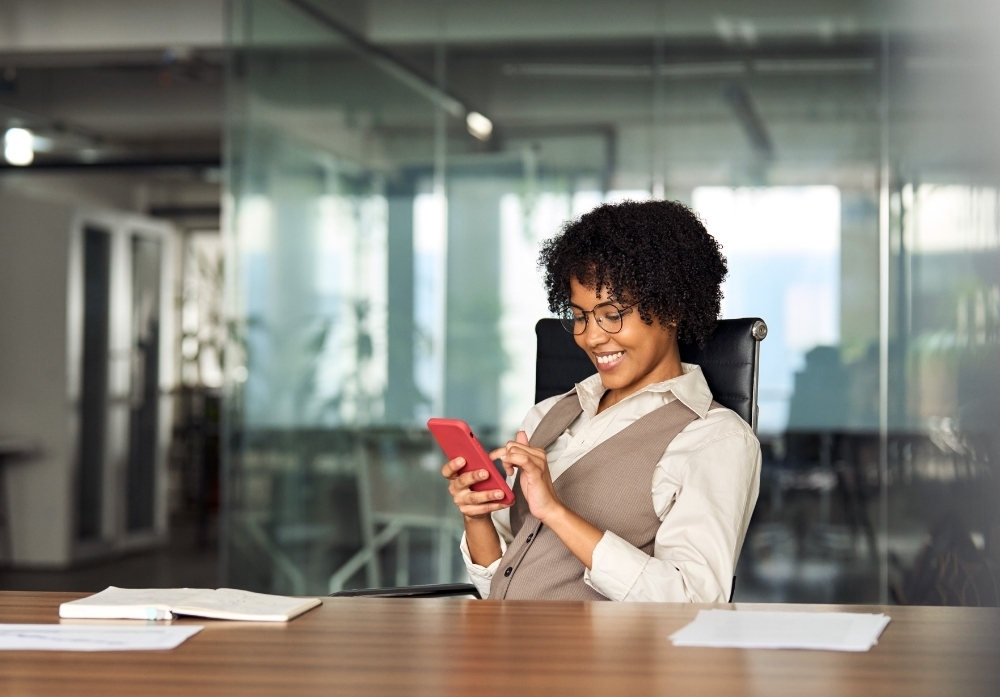 A Woman Using an Iphone  