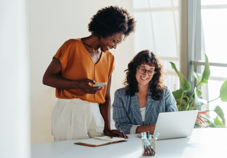 two professional women in a meeting